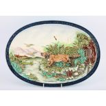 Sarreguemines oval majolica platter depicting a setter chasing ducks, impressed marks,