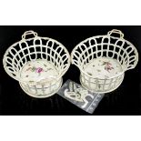 Pair of Loosdrecht oval reticulated baskets. with entwinned handles, the bases depicting insects