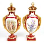 Pair of Crown Derby vases and covers, the red ground with panels of winged cherubs under a