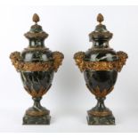 † Pair of French 19th century green marble and gilt metal mounted table top urns,
