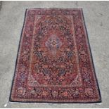 Persian rug, central lozenge with foliate scrolls and multiple borders, 204 x 130cms