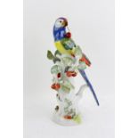 Modern Meissen figure of a parrot holding a cherry on stalk, on naturalistic base,