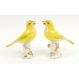 Meissen figure of a yellow canary, perched on a branch, crossed swords mark, impressed no. 227,