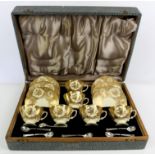 Cased set of six Hammersley coffee cups and saucers, with gilded floral decoration and six spoons