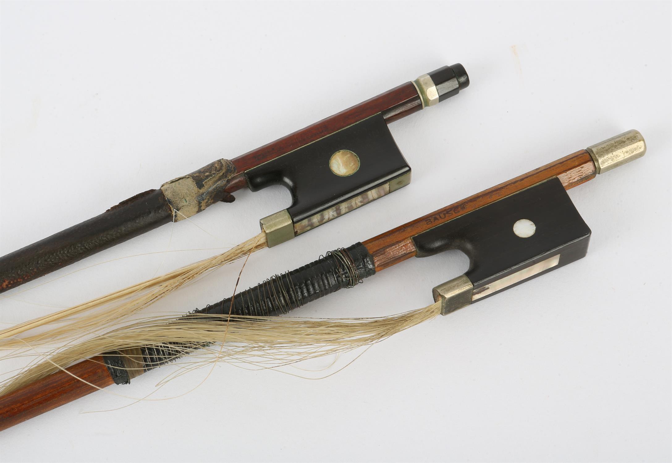 Violin bow stamped Vuillaume á Paris, round stick with ebony frog inlaid with pearl eyes and the