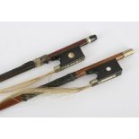 Violin bow stamped Vuillaume á Paris, round stick with ebony frog inlaid with pearl eyes and the