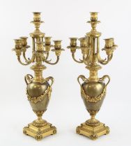 † A pair of French style ormolu Candelabra, each with central candle holder and five branches on