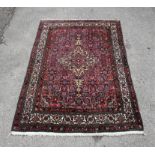 Persian design rug, the red ground with all over foliate design, 246 x 165cms