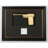 James Bond The Man With The Golden Gun (1974) - A replica golden gun, mounted inside a framed