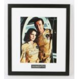 James Bond - Roger Moore and Lois Chiles signed Moonraker photo, framed, overall 35 x 40 cm.
