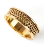 Gold band ring, 6mm width band with a ball and circle design, in tested 18 ct,, ring size O½
