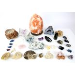 Collection of geodes, crystals and fossils, including an amethyst segment, rock crystal,