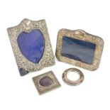 Four silver photo frames, 3 of which are embossed variety of dates.