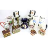 Collection of Staffordshire pottery cottages, two spill vases, pair of Spaniels, pair of cats, jugs,