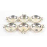 Set of six silver dishes with ribbon bow decoration that forms handle