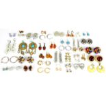 A large collection of fashion earrings, mostly for pierced ears, some clip-ons, some in silver