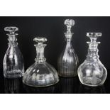 Nine various cut and moulded glass decanters,