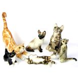 Winstanley pottery cats, including a ginger tom with glass eyes H33cm, Tabby cat H24c,