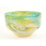 Monart, a glass bowl decorated with a leaping fish, in yellows, greens and blue, paper label to