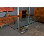 Glass and polished steel dining table, Contemporary, the shaped glass top with a bevelled edge,