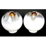 Attributed to Italian School, a pair of white glass lamp globes, the bases in trefoil form with