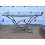 Polished steel console table, Contemporary, the top with bow front, inset with bevelled glass plate,