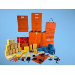 HERMES and GERRARD (The Crown Jewellers.) A large collection of boxes, bags, silk pillows, ribbon,