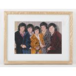 The Osmonds - Multi signed colour photograph of the American family music group, framed and glazed,