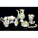 Continental floral encrusted porcelain, including a miniature coffee pot, miniature vase,