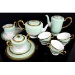 Okura part tea service, with pale green and gilt borders, for six place settings including tea cups