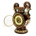 Majolica style chocolate and foliate glazed Mantel clock with Serpent form handles