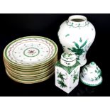 Ten Haviland Limoges 'Vieux Paris' plates, 25 cm diameter, a faience baluster vase and cover with