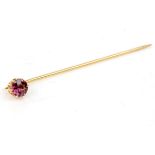 Gold tie pin set with garnet in tested 9ct gold