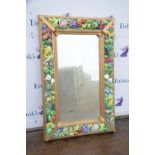 Contemporary gilt framed highly decorative landscape mirror with fruit and floral borders,