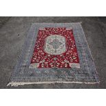 Persian carpet, oval ochre medallion, with quatrefoil motif, foliate design, with red field and