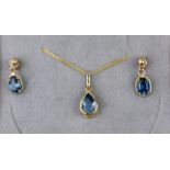 Cased 9 carat gold necklace pendant and earring suite, set with topaz