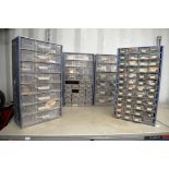 A selection of blue wall drawers for workshop use containing accessories.