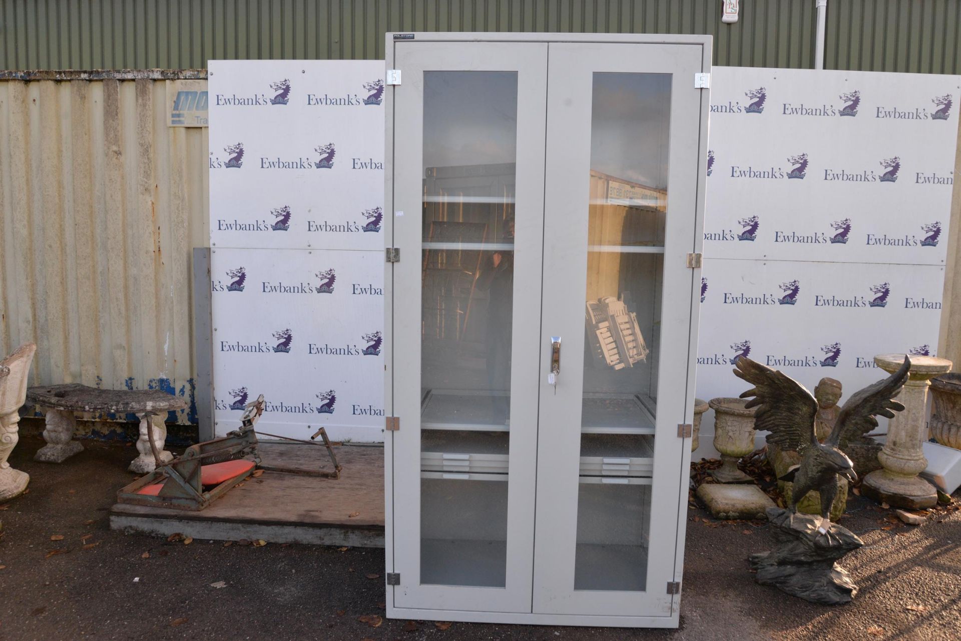 Postore Large grey cabinet with glass doors. Measurements: H220cm W.115cm D.60cm.