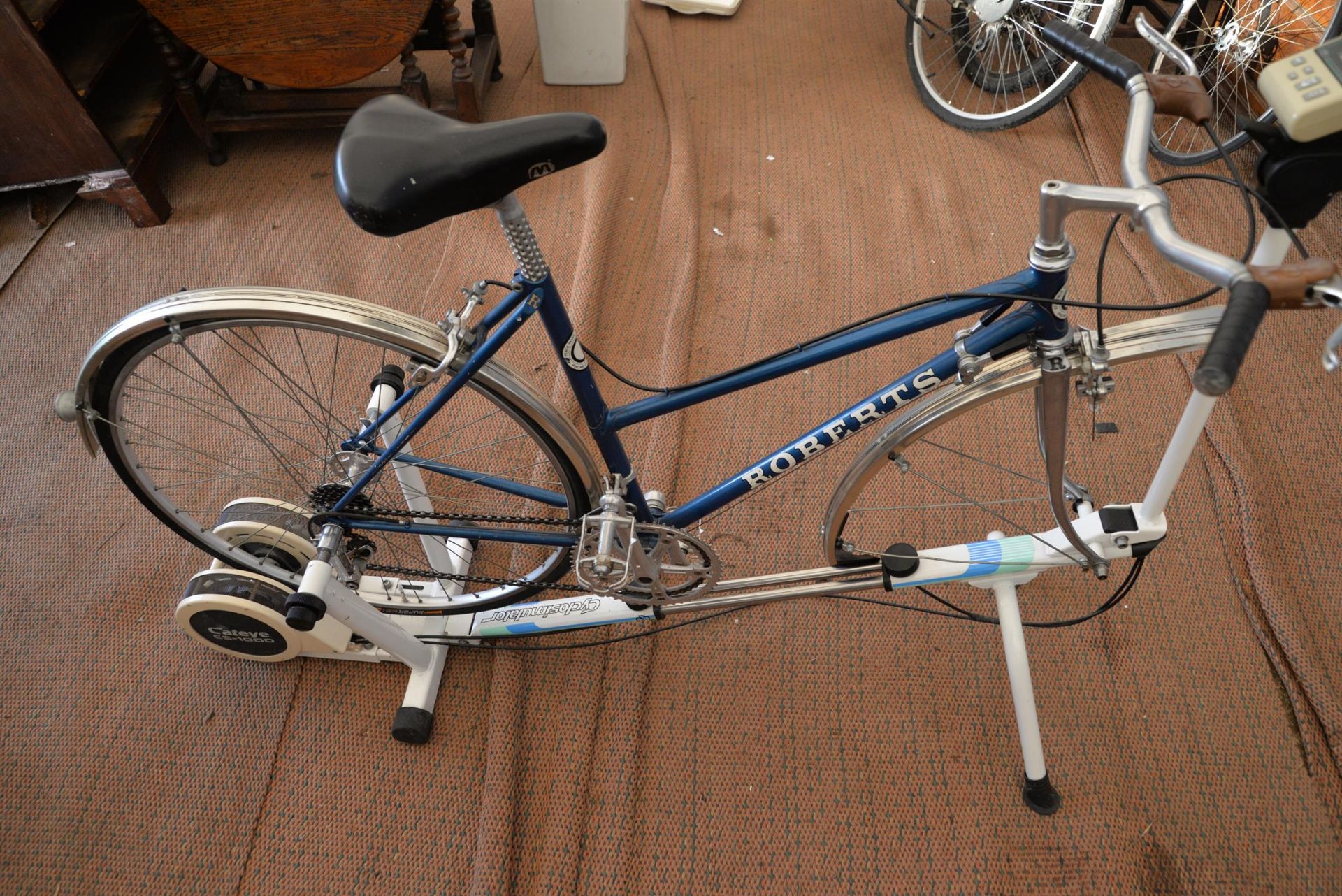 A ladies British handmade Roberts bicycle mounted on a Cyclosimulator Cateye C S 1000 exercise