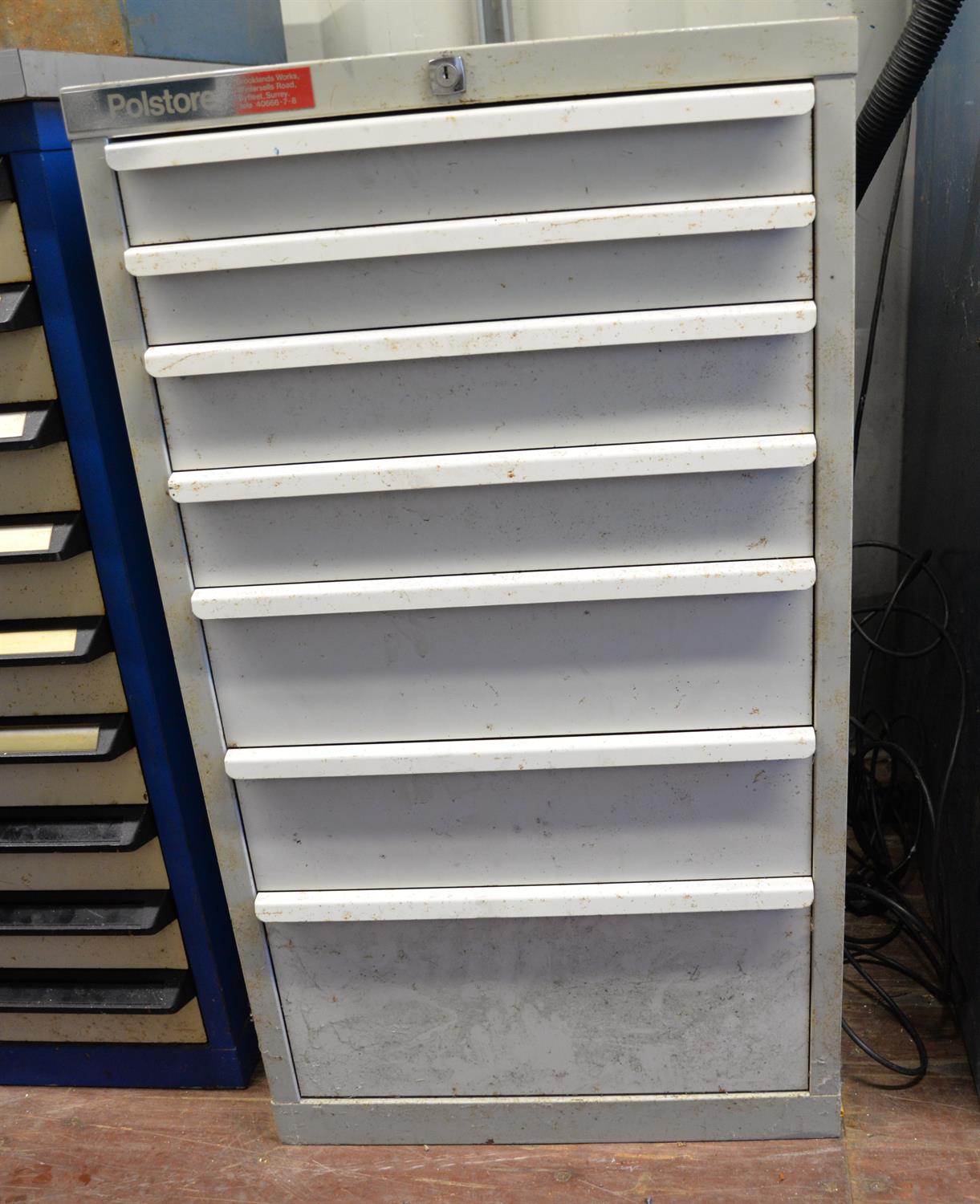 A Polstore grey metal workshop cabinet of seven drawers full of fittings etc. Measurements: H.