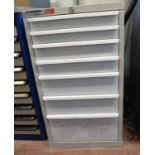 A Polstore grey metal workshop cabinet of seven drawers full of fittings etc. Measurements: H.