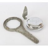 Bentley chrome hub cap nut marked OFF-On, with cast alloy spanner RF 3851 and two winged car