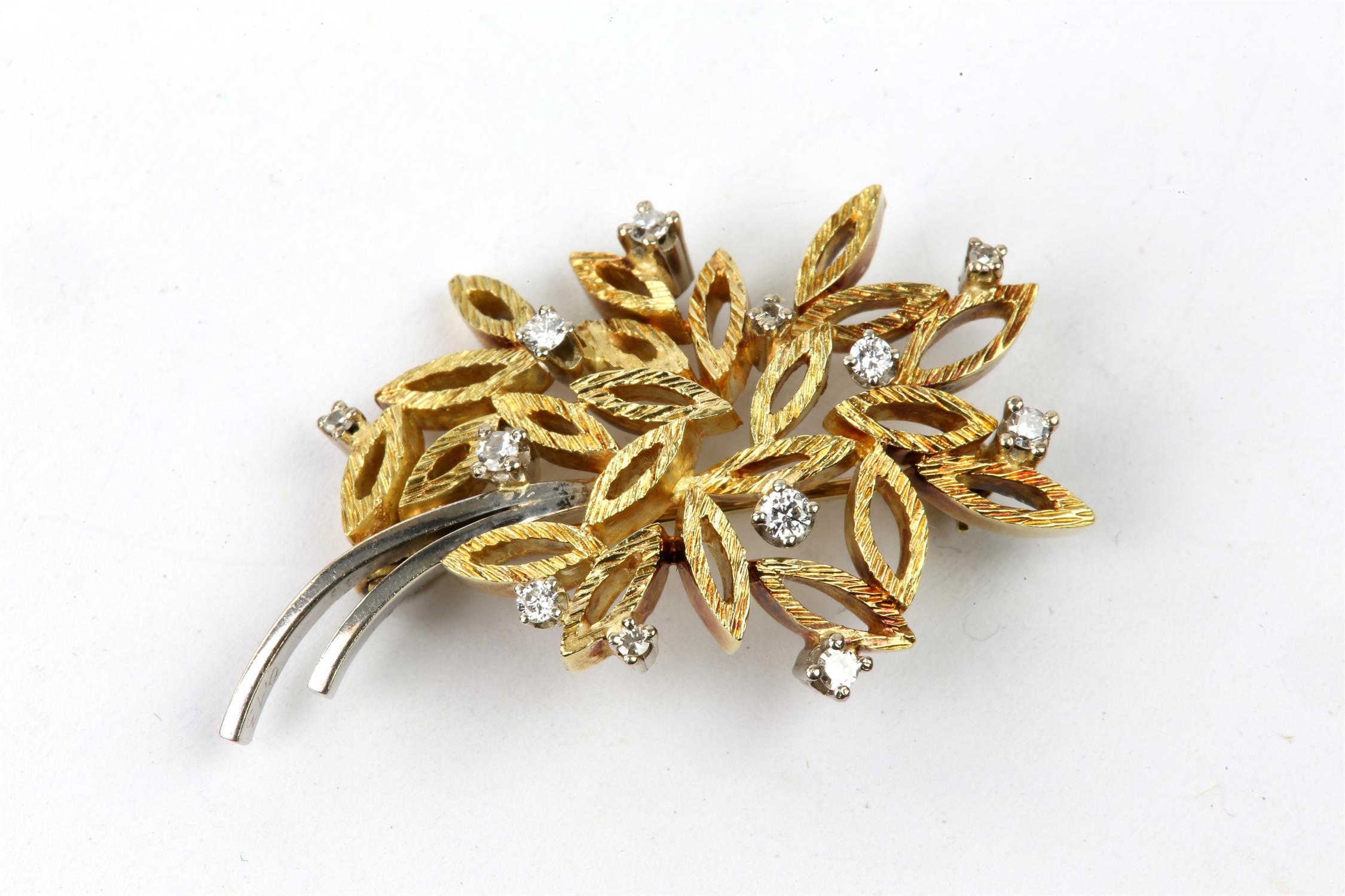 Diamond set brooch, small single cut and round brilliant cut diamonds mounted in a bunch of flowers