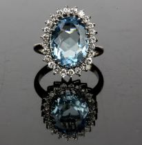 Aquamarine and diamond cluster ring, oval cut aquamarine weighing an estimated 4.
