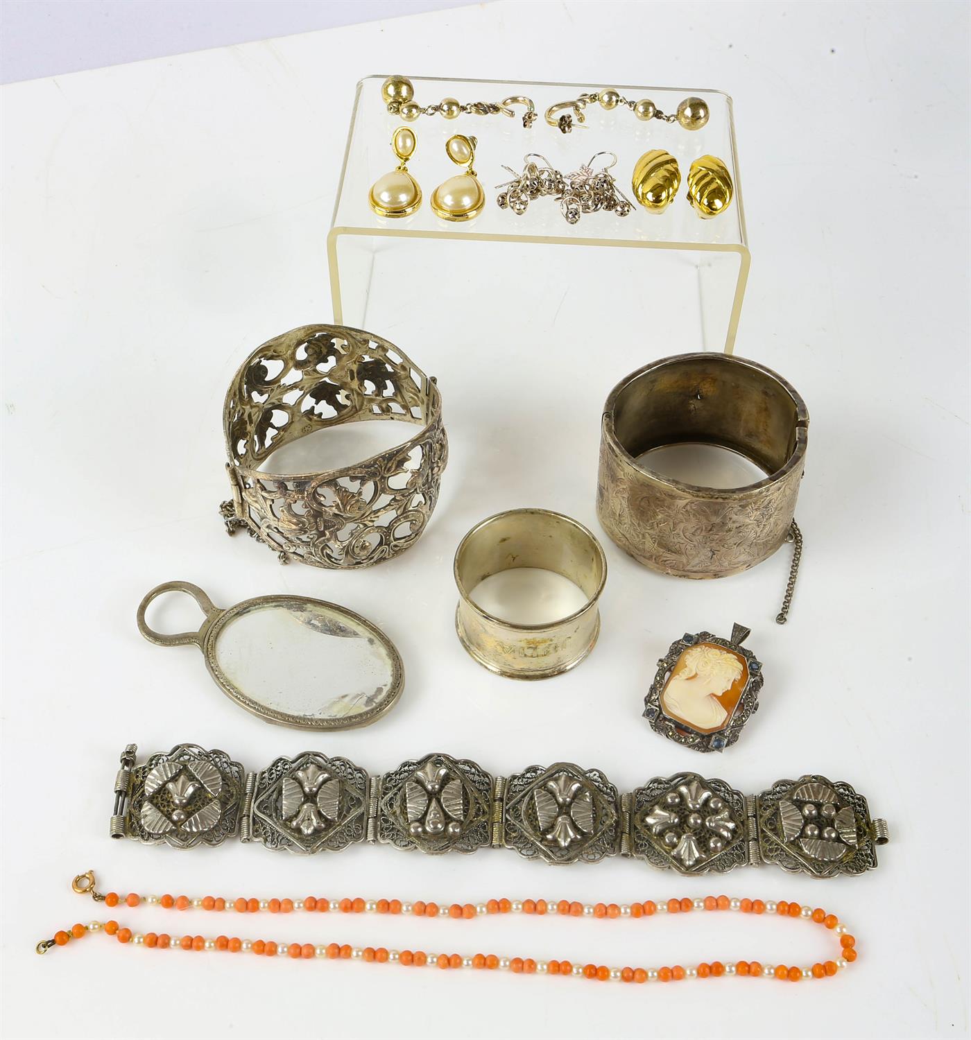 Selection of silver jewellery, including a large openwork bangle, a large hinged bangle,