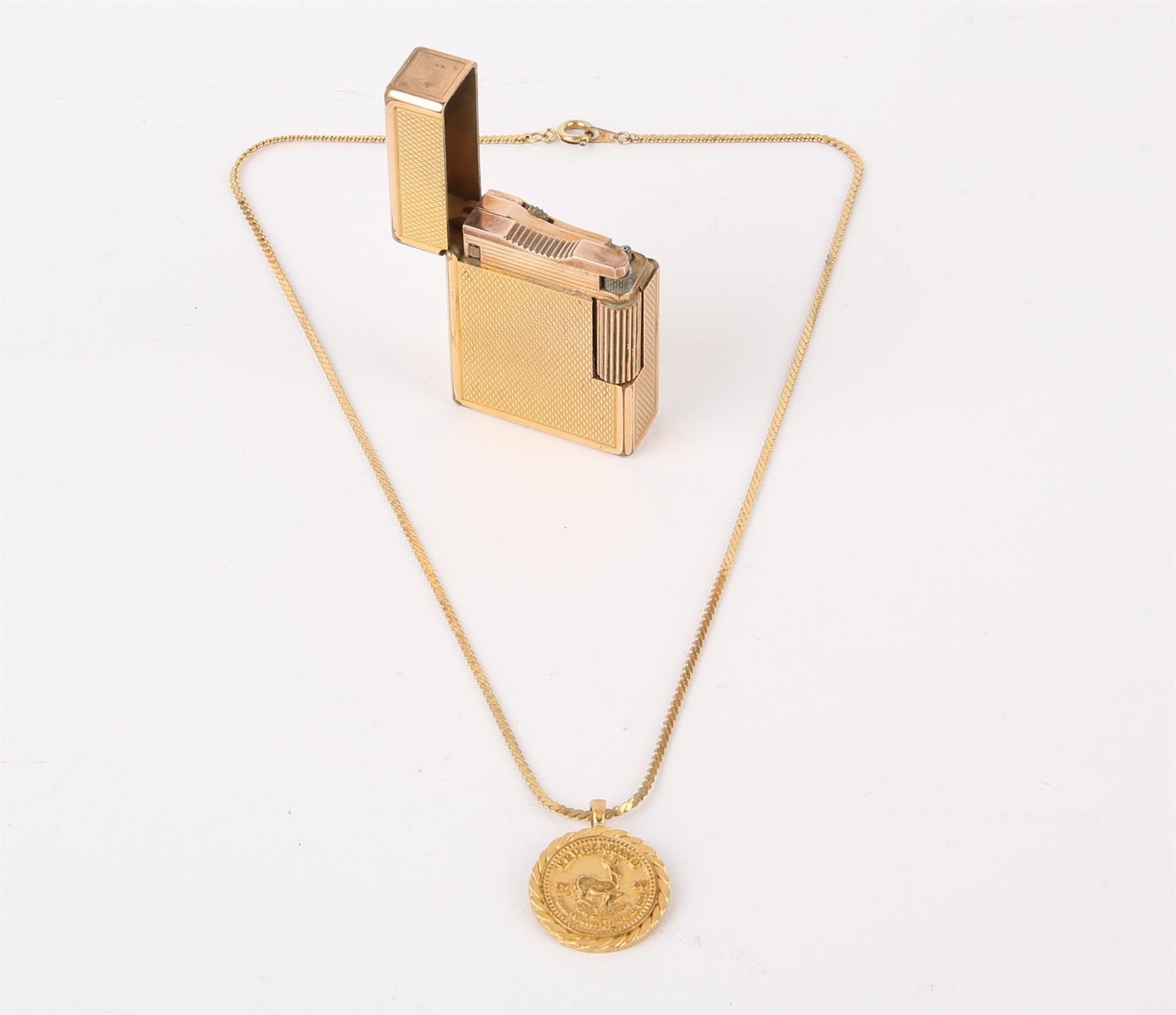 Dupont lighter and costume necklace, a Dunhill gold plated rollagas lighter, BM 752,