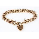 9ct gold curb chain bracelet with a heart padlock fastening and safety chain