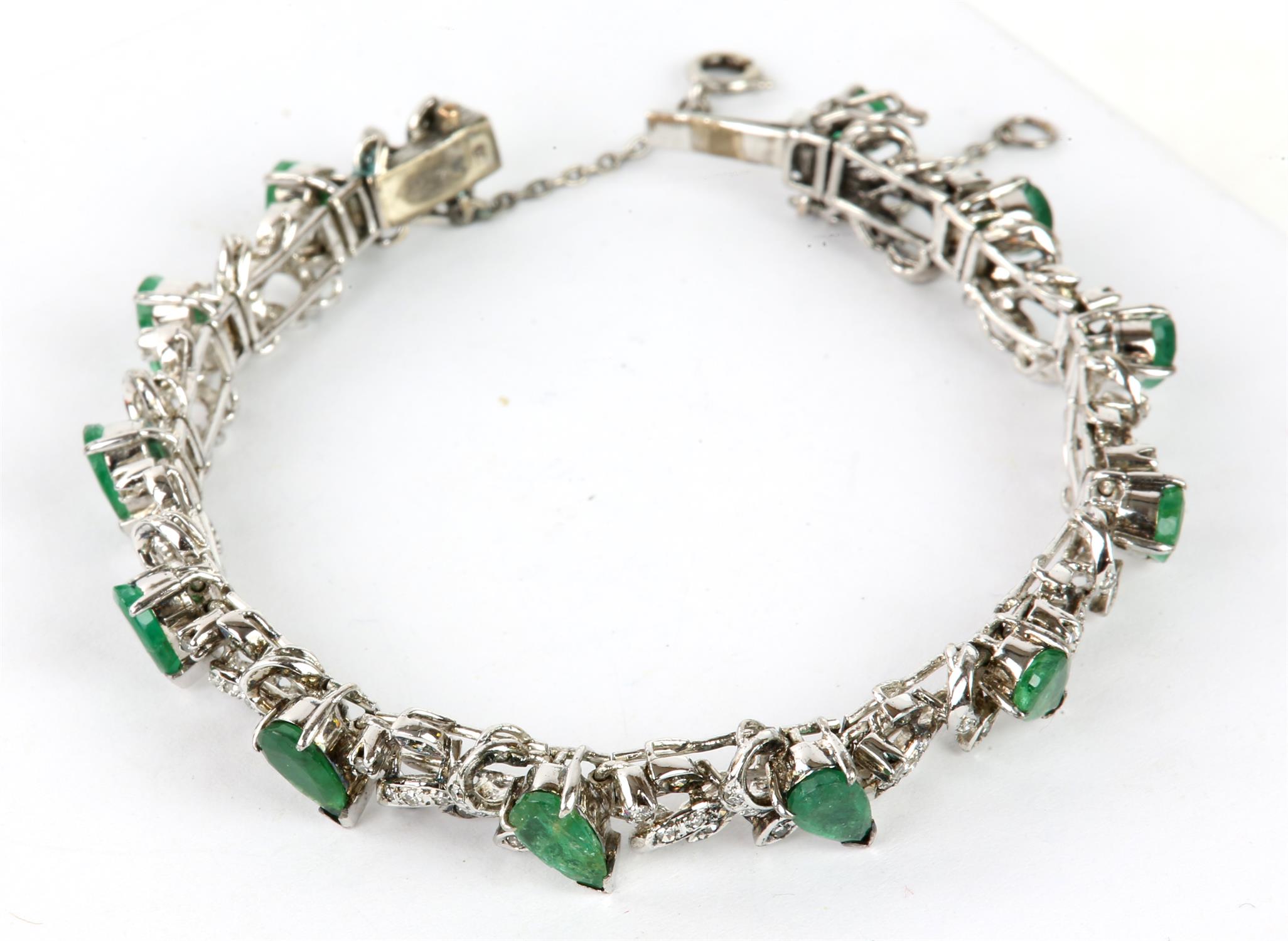 Emerald and diamond line bracelet, twelve pear shaped emeralds separated by a foliate design set - Image 4 of 4