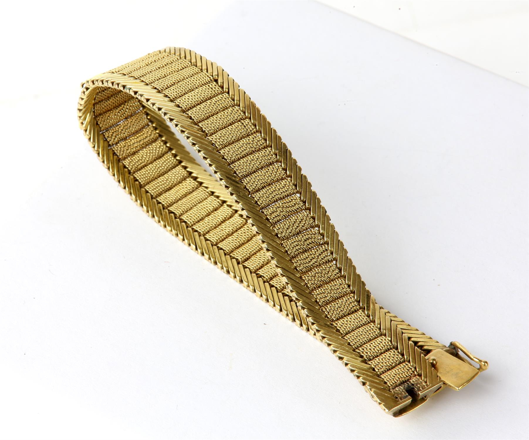 Fancy link gold bracelet, a tapered mesh panel design with diagonal bar design edging,