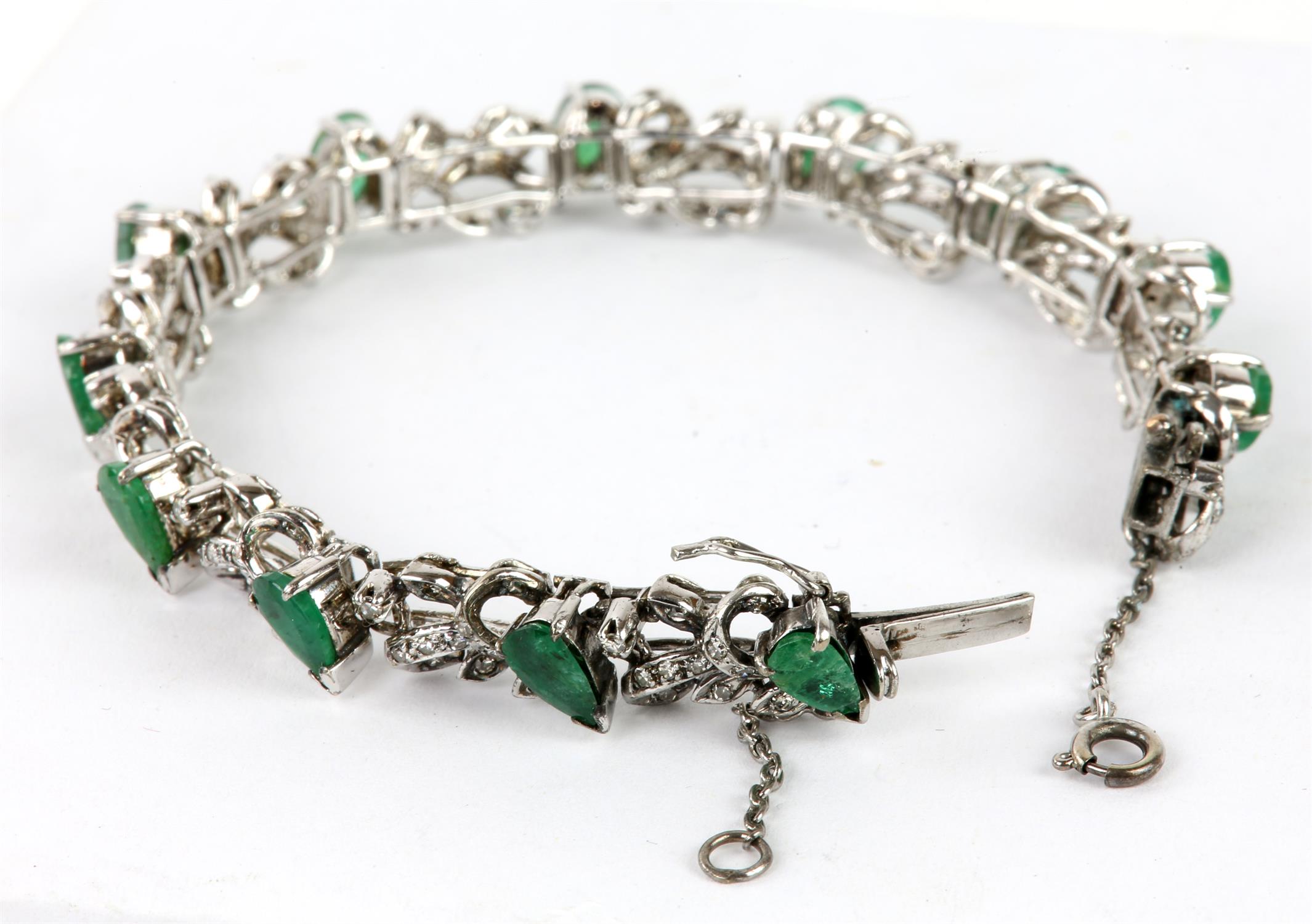 Emerald and diamond line bracelet, twelve pear shaped emeralds separated by a foliate design set - Image 2 of 4